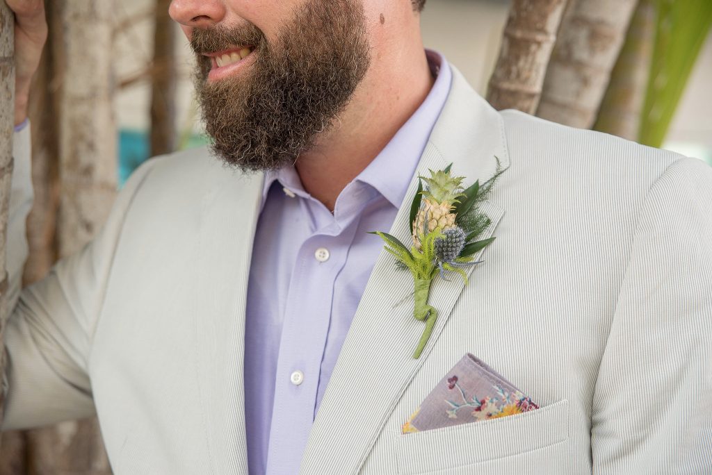 Tropical boutonniere with thistle and a miniature pineapple.