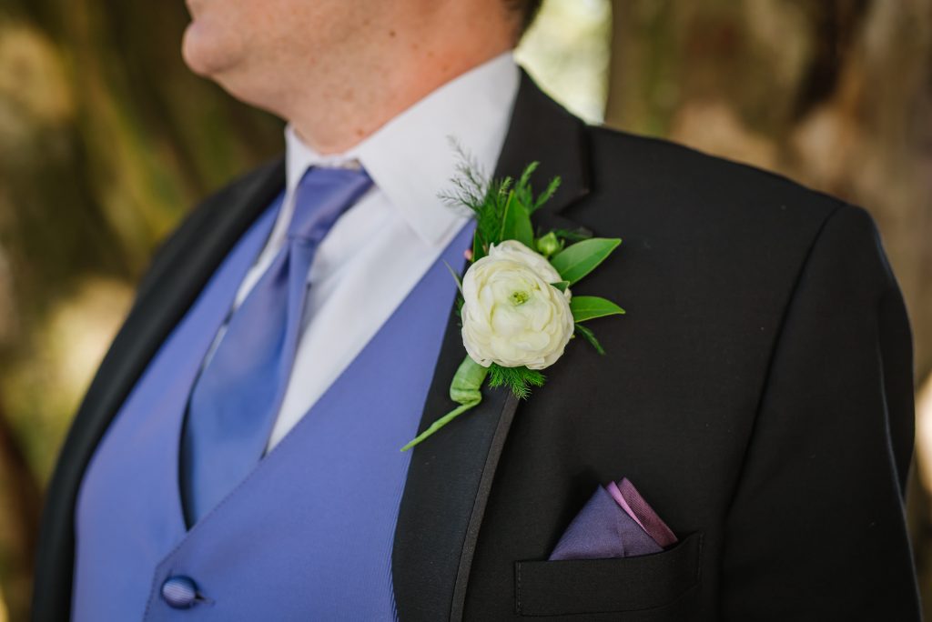 Simple white boutonniere with ranunculus.