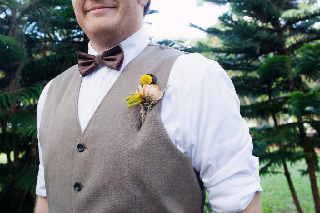 Boutonniere of bille ball, ranunculus and monkey tail.