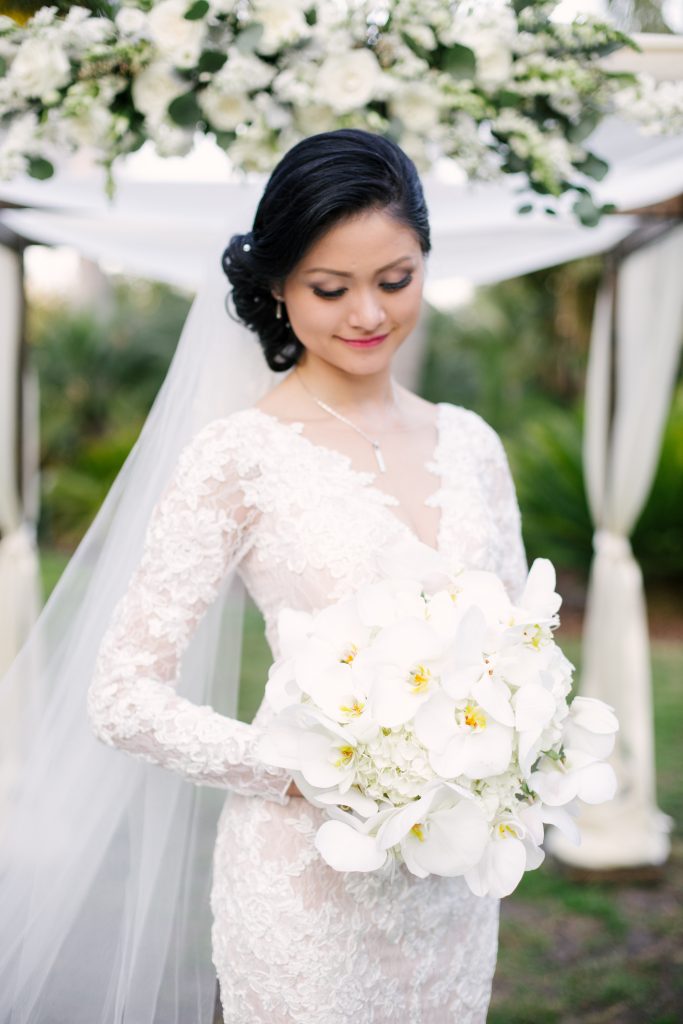 All white bridal bouquet of phalaenopsis orchids.