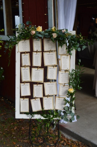 Seating chart flowers and garland.