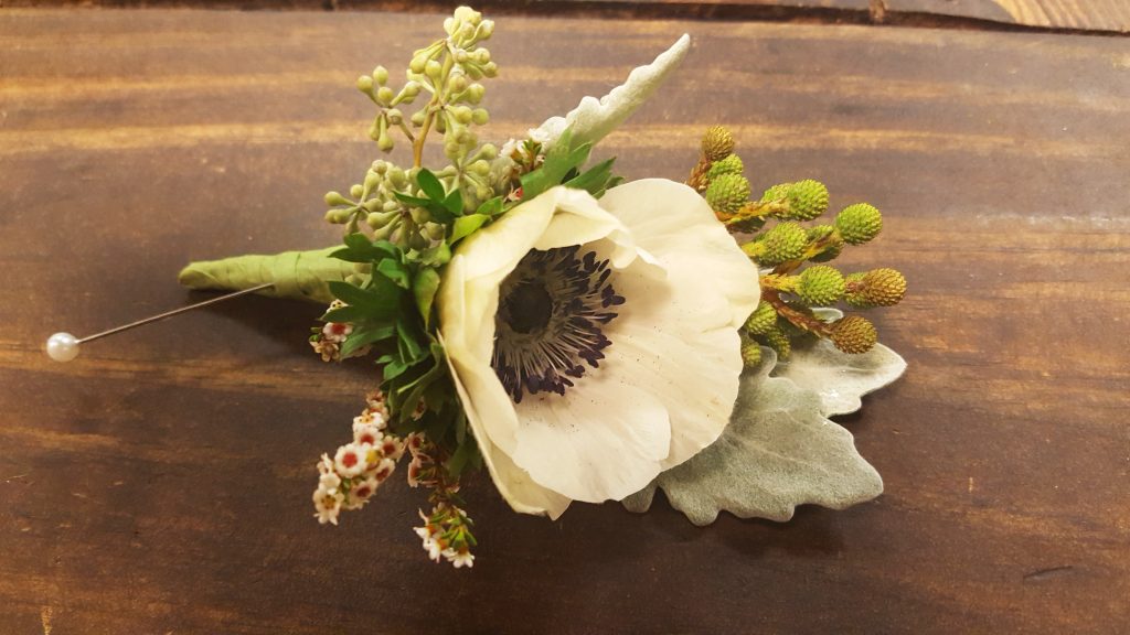 White anemone boutonniere.