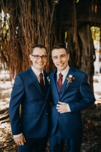 Red and white spray rose and eucalyptus groom's boutonniere in St. Petersburg, Florida.