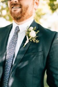 White spray rose and eucalyptus groomsman boutonniere in St. Petersburg, Florida.