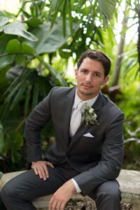 Succulent and white spray rose groom's boutonniere in St. Petersburg, Florida.