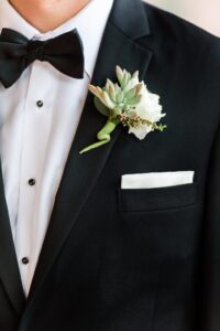 Succulent and white lisianthus groom's boutonniere in St. Petersburg, Florida.