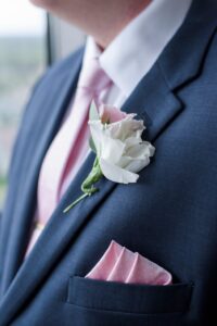 White and pink lisianthus groom's boutonniere in St. Petersburg, Florida.