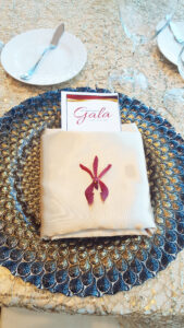 Red orchid place setting flower for Florida Orchestra Gala.