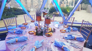 White and gold low centerpiece for corporate holiday event.