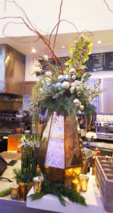 Dramatic and modern bar centerpiece for corporate holiday event.