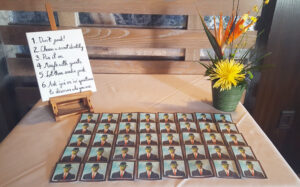 Tropical centerpiece and game on table for birthday party.