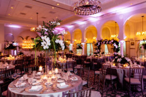 Tropical orchid elevated centerpiece at reception at Vinoy's Sunset Ballroom in St. Petersburg, Florida.