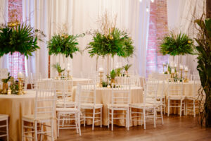All greenery elevated centerpieces with curly willow and hanging votives at Nova 535 in St. Petersburg, Florida.