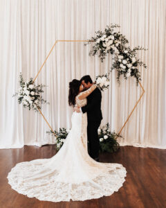 Organic all white hexagon arch for wedding ceremony at the Orlo House in St. Petersburg, Florida.