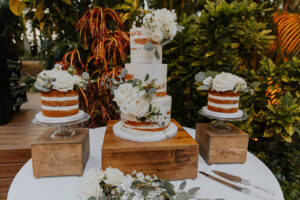 Rustic white cake flowers at wedding reception at Sunken Gardens in St. Petersburg, Florida.