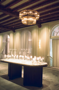 Entrance table with floating candles at wedding reception at the Vinoy Grand Ballroom in St. Petersburg, Florida.