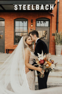 Fall colored boho bridal bouquet with pampas grass at Armature Works in Tampa, Florida.