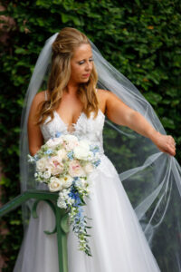White, blush and light blue cascading bridal bouquet in St. Petersburg, Florida.