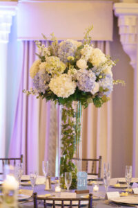 Blue and white hydrangea elevated centerpiece at wedding reception at Vinoy's Sunset Ballroom in St. Petersburg, Florida.