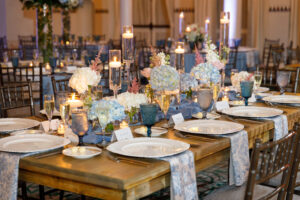 Romantic feasting tables of white and blue flowers with candlelight at the Vinoy's Sunset Ballroom in St. Petersburg, Florida.