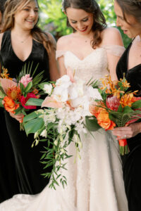 White tropical bridal bouquet and colorful tropical bridesmaid bouquets in St. Petersburg, Florida.