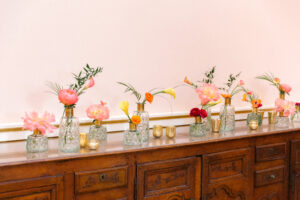 Colorful table scape of peonies at wedding reception at Museum of Fine Arts in St. Petersburg, Florida.