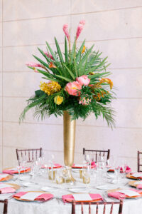 Colorful tropical elevated centerpiece at wedding reception at Museum of Fine Arts in St. Petersburg, Florida.