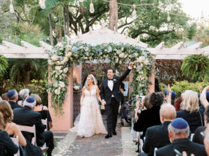 Romantic and garden style chuppah of white and baby blue hydrangea for outdoor wedding at the Vinoy Tea Garden in St. Petersburg, Florida.