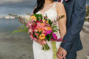 Colorful pink and orange tropical bridal bouquet with Peony and Orchids in St. Petersburg, Florida.