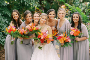Colorful tropical bridal and bridesmaid bouquets at Sunken Gardens in St. Petersburg, Florida.