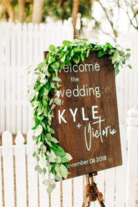 Greenery garland on welcome sign for wedding in St. Petersburg, Florida.
