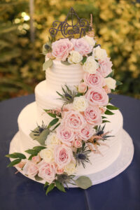 Cascading pink rose cake flowers at wedding reception in St. Petersburg, Florida.