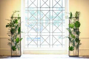 Modern greenery walls for altar at wedding ceremony at the Vinoy in St. Petersburg, Florida.