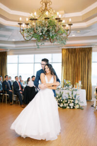 Greenery chandelier over dance floor at wedding reception at Isla del Sol in Tierra Verde, Florida.