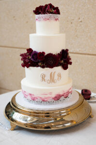 Burgandy cake flowers at wedding reception at Museum of Fine Arts in St. Petersburg, Florida.