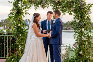 Organic smylax greenery arch for wedding ceremony at Vinoy in St. Petersburg, Florida.