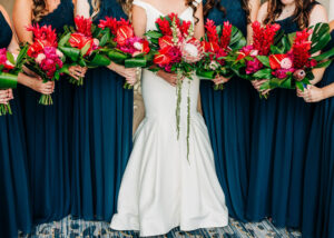Tropical red bridal and bridesmaid bouquets in Tampa, Florida.