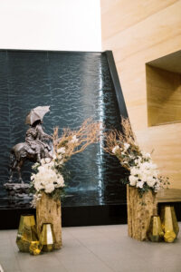 Modern manzanita arch with lanterns for wedding ceremony altar at the James Museum in St. Petersburg, Florida.
