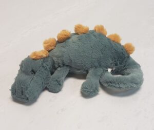 Jellycat's 10" green and yellow Douglas Dino laying down